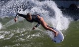 Surfers, like the one pictured here, hit the artificial waves Wednesday morning, practicing for this weekend's Freshwater Pro. Official action gets underway today (Sept. 19). The event continues thru Sunday.